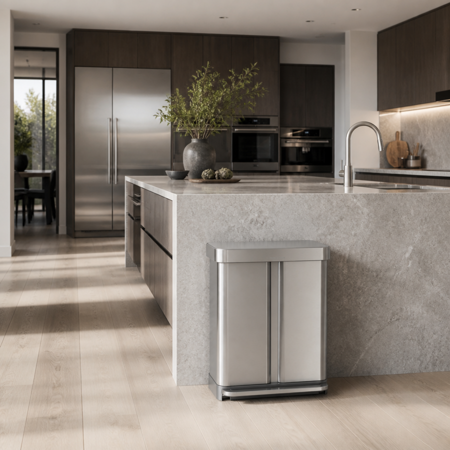 Simplehuman's 58L Step Recycler in Brushed in a modern kitchen setting with marble countertop and natural lights. 