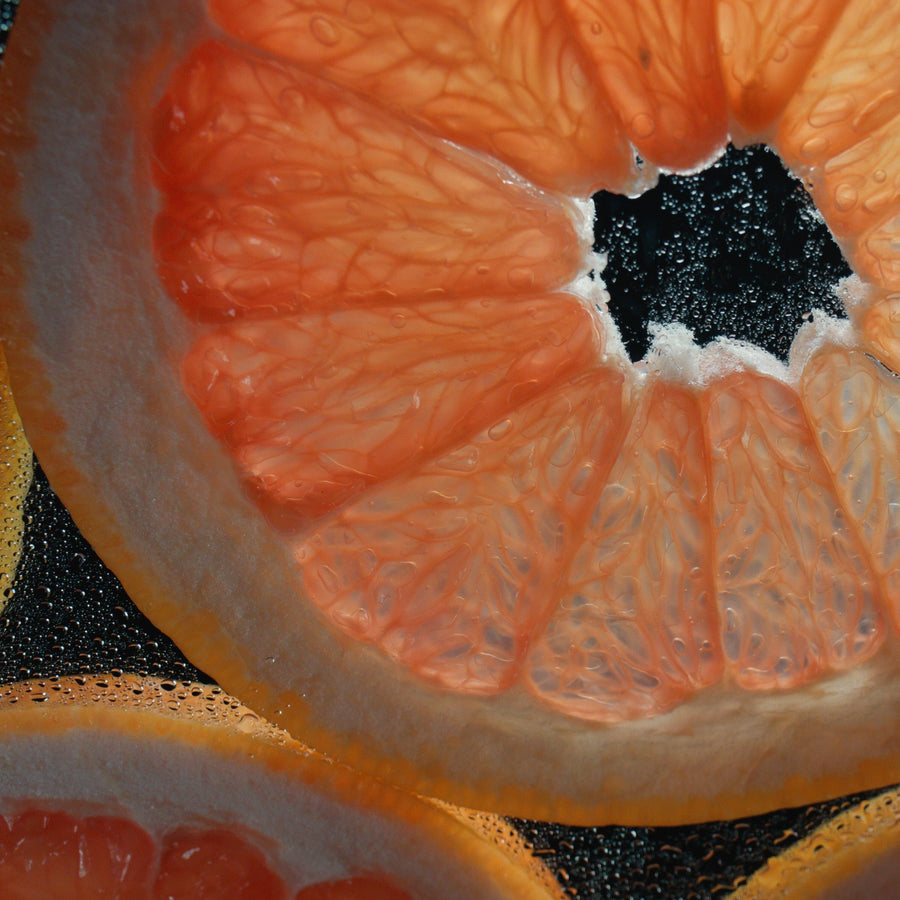 Detail view of Simplehuman Multi-Surface Cleaning Tablets Citrus Grapefruit scent, showing translucent fruit slices.